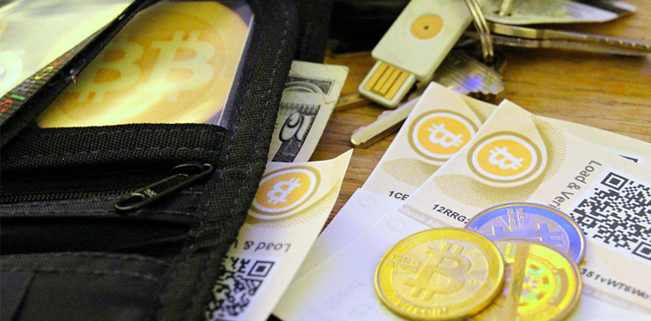 Wallet with bitcoin, paper dollar and bitcoin voucher