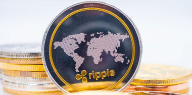 Ripple coin on top of coins