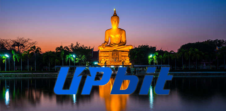Upbit logo with Wat Phai Rong Wua in background night time