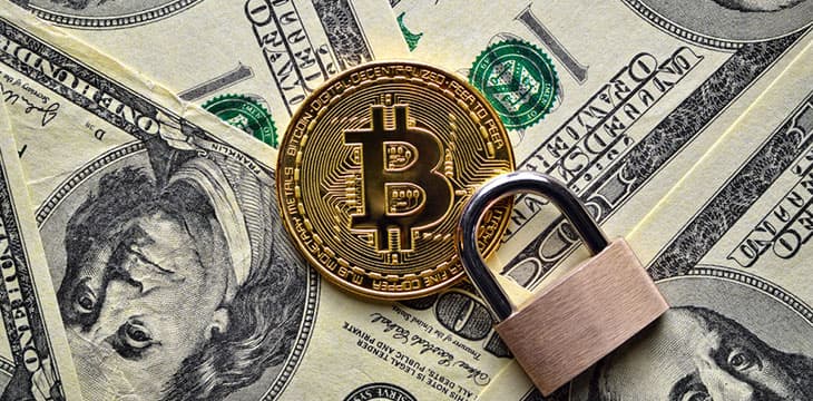 Bitcoin cryptocurrency is protected by a lock, unlike the US dollar