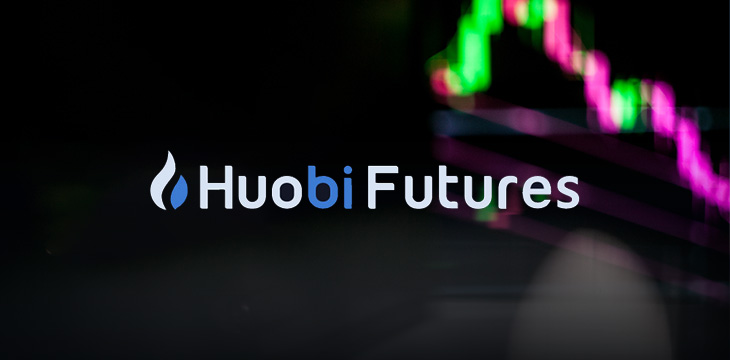Huobi Futures with background of stock exchange charts and listings displayed on computer screen