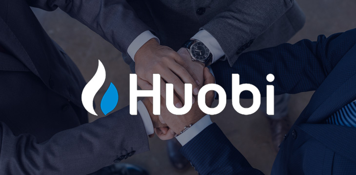 Huobi logo with background of business people stacking hands partnership concept