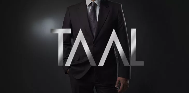 TAAL logo with man in a business suit in the background