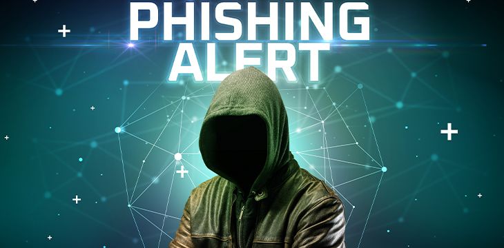 Mysterious hacker with PHISHING ALERT inscription, online attack concept inscription, online security concept