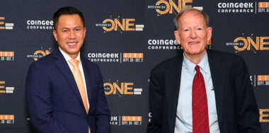 Photo of Jimmy Ngyuen and George Gilder