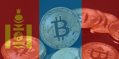 Blurred Mongolian flag on top of Bitcoin.