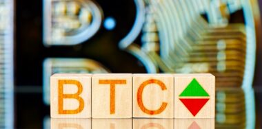btc concept. wooden blocks with btc inscription and arrows symbolizing the rise and fall