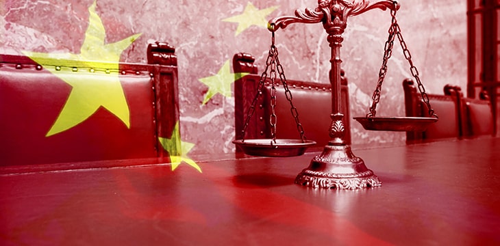 Save Download Preview Decorative Scales of Justice on the red table with Chinese flag