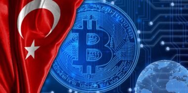 Flag of Turkey is shown against the background of crypto currency bitcoin