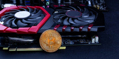 Bitcoins lie on the video card, concept of mining. Blockchain and mining concept