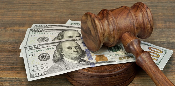 Judges or Auctioneer Gavel Soundboard And Bundle Of Dollar Cash On The Rough Wooden Textured Table Background.
