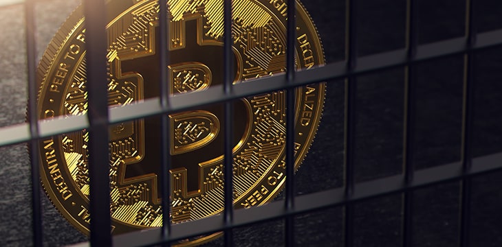Bitcoin token behind jail bars
