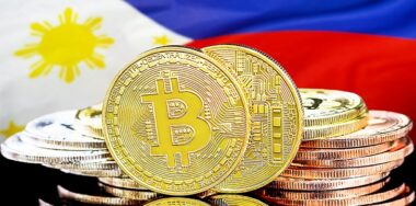 Bitcoins on the background of the flag Philippines.