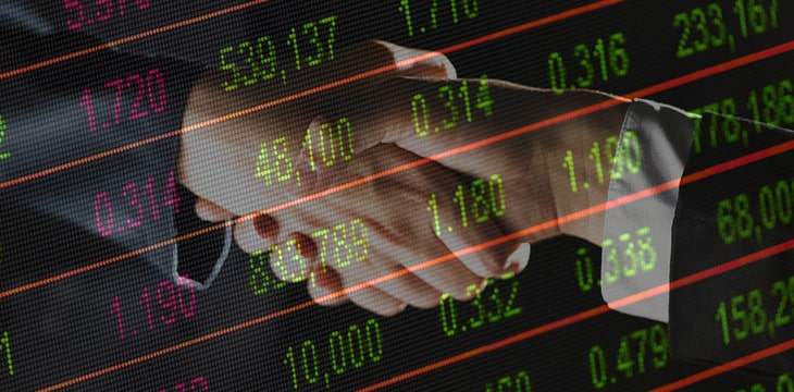 Stock Market screen on a background of business men shaking hands (zoomed)