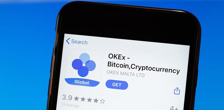 OKEx app mobile logo close-up on screen display