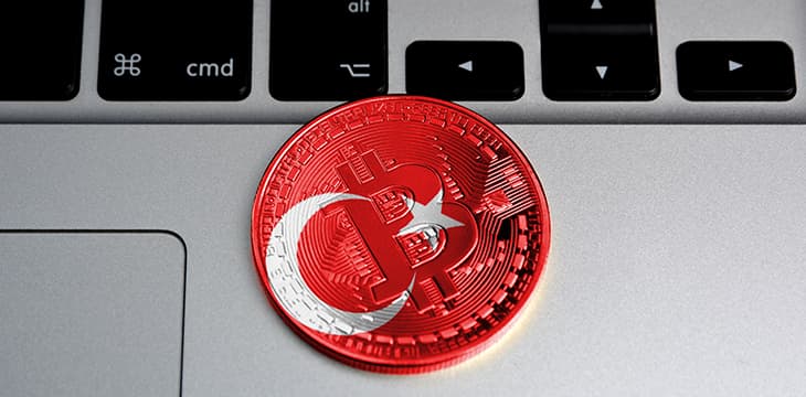 Bitcoin close-up on keyboard background, the flag of Turkey