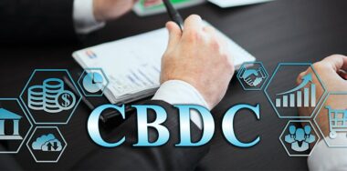 Business management concept - group of businessmen in office with digital business icons, graphic banner showing symbol of banking, commercial assistance. Inscription: CBDC
