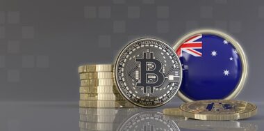 Bitcoins in front of an badge with the Australian flag