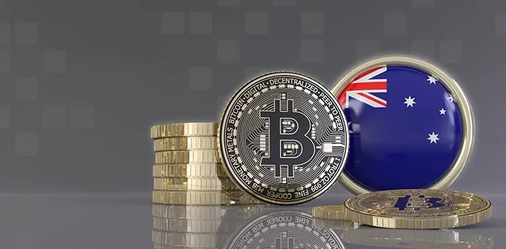 Bitcoins in front of an badge with the Australian flag