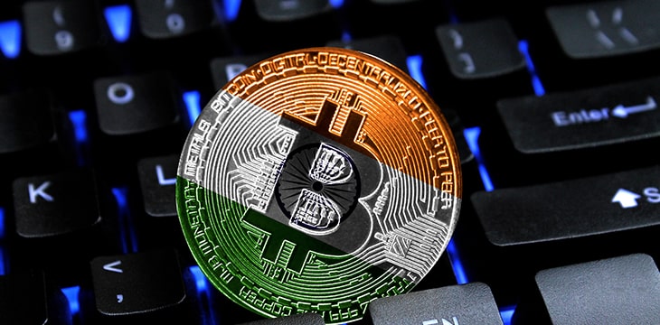 Bitcoin close-up on keyboard background, the flag of India is shown on bitcoin