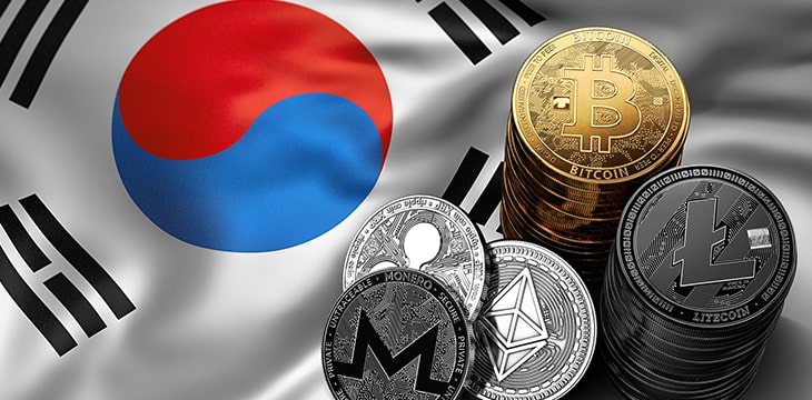 Stack of Bitcoin coins on South Korean flag.
