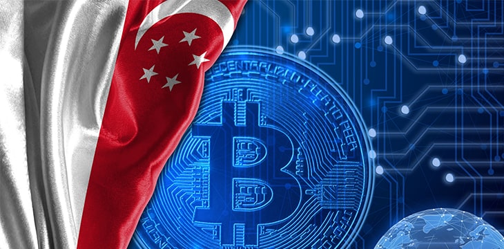 Flag of Singapore is shown against the background of crypto currency bitcoin.