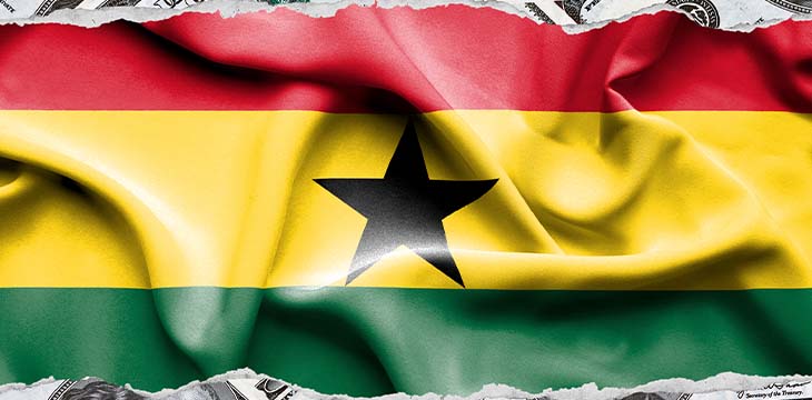 flag of Ghana with money behind it
