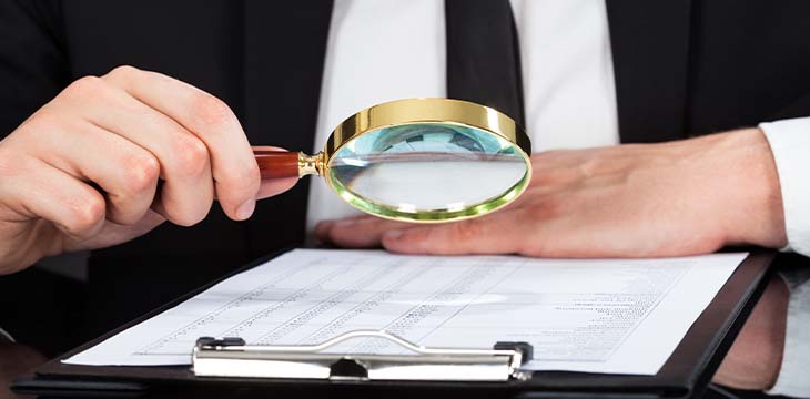 Businessman With Magnifying Glass