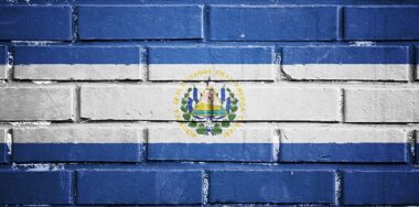 El Salvador flag on brick wall