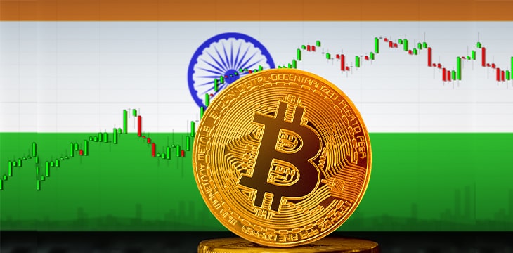 Bitcoin on the background of Indian flag