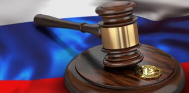 Bitcoin and judge gavel laying on flag of Russia. Bitcoin legal situation in Russia concept. 3D rendering — Stock Editorial Photography