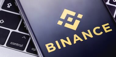 Binance logo on the screen smartphone