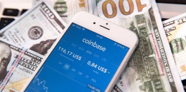 coinbase on mobile with money background