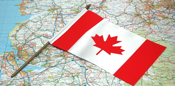 Canadian flag over map