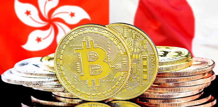 Bitcoins on Hong Kong and Japan flag background