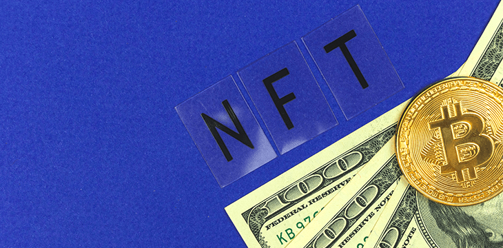 NFT word with paper money and a coin image of Bitcoin