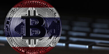 Bitcoin with a flag of Thailand theme close-up on keyboard background