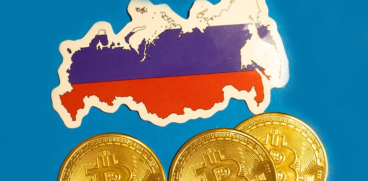 Russia Flag with Bitcoin flat lay