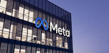 Meta signage logo on top of glass building