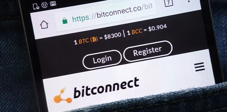 Bitconnect website displayed on smartphone hidden in jeans pocket