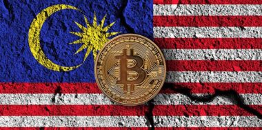 Bitcoin crypto currency coin with cracked Malaysia flag