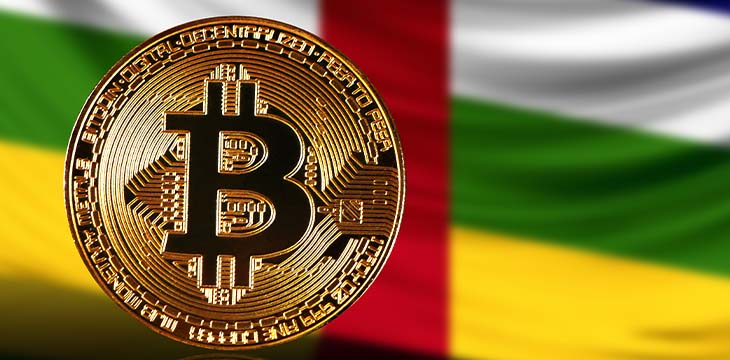 Gold coin bitcoin on a background of a flag Central African republic