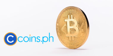 Close up view of golden bitcoin with coins.ph logo