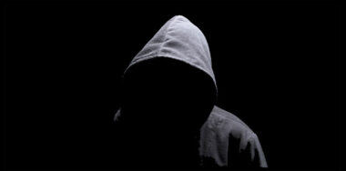 Hooded man in the shadow