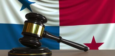 Judges gavel and block against the flag of Panama.