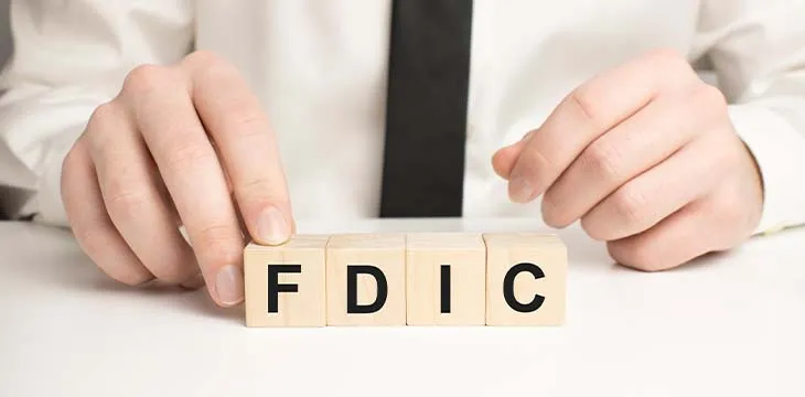 Man made word fdic with wood blocks