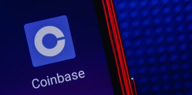 Coinbase app on smartphone screen.
