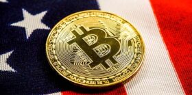 Crypto currency bitcoin btc golden bit coin against flag of United States of America USA. Virtual money, blockchain business, internet finances concept.