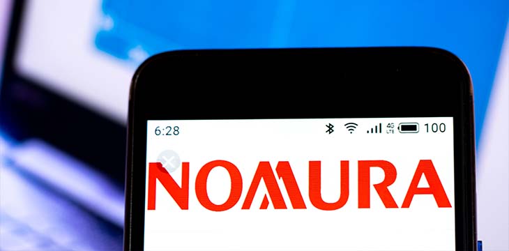 In this photo illustration the Nomura Holdings, Inc. logo is seen displayed on a smartphone
