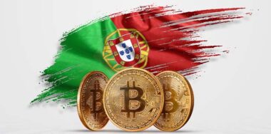 Crypto currency, gold coin BITCOIN BTC. Coin bitcoin against the background of the flag of Portugal. The concept a new currency, Blockchain Technology , a token.
